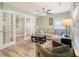 Inviting living room with French doors, neutral decor, and hardwood floors at 9316 Sweetbay Ct, Ladson, SC 29456