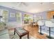 Open living space with hardwood floors connecting living, dining, and kitchen areas, offering great flow at 9316 Sweetbay Ct, Ladson, SC 29456