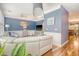 Stylish living room features hardwood floors, blue walls, and modern decor at 9316 Sweetbay Ct, Ladson, SC 29456