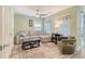 Comfortable living room featuring a sectional sofa, accent chair, and stylish decor at 9316 Sweetbay Ct, Ladson, SC 29456