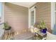 Outdoor porch with lounge chair and table offers a relaxing place to enjoy the weather at 9316 Sweetbay Ct, Ladson, SC 29456