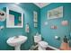 Cozy bathroom with white fixtures, dark wood floors, and charming beach decor to create a relaxing, coastal atmosphere at 1005 Golden Aspen Dr, Moncks Corner, SC 29461