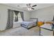 Cozy bedroom with neutral carpet, a double bed, window with curtains, and a corner desk setup at 1005 Golden Aspen Dr, Moncks Corner, SC 29461