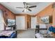 Spacious bedroom with neutral walls, a large carpet, two twin beds, and a TV on each side of the room at 1005 Golden Aspen Dr, Moncks Corner, SC 29461