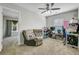 Versatile room with a comfortable recliner, functional desk space, and large window at 1005 Golden Aspen Dr, Moncks Corner, SC 29461