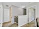 Upstairs hallway featuring neutral walls, carpet, and doors leading to various rooms at 1005 Golden Aspen Dr, Moncks Corner, SC 29461