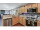 Bright kitchen featuring stainless steel appliances, wooden cabinets, and an open design at 1005 Golden Aspen Dr, Moncks Corner, SC 29461