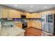 Well-lit kitchen features stainless steel appliances, granite countertops, and wood flooring at 1005 Golden Aspen Dr, Moncks Corner, SC 29461