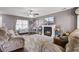 Comfortable living room with a fireplace, ample seating, and hardwood flooring for a welcoming atmosphere at 1005 Golden Aspen Dr, Moncks Corner, SC 29461