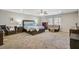 Spacious main bedroom featuring neutral walls, soft carpet, and a comfortable seating area at 1005 Golden Aspen Dr, Moncks Corner, SC 29461