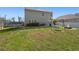 Backyard view of home with trampoline, fire pit, swing, and basketball court at 1019 Victoria Pointe Ln, Summerville, SC 29485