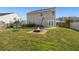 Home's backyard with a fire pit, basketball hoop, and a trampoline at 1019 Victoria Pointe Ln, Summerville, SC 29485