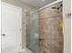 Modern bathroom showcasing a glass-enclosed shower with beige tiling and dual shower heads at 1019 Victoria Pointe Ln, Summerville, SC 29485