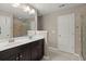 Bathroom with double sinks, dark cabinets, and a shower/tub combination at 1019 Victoria Pointe Ln, Summerville, SC 29485