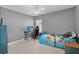 Cozy bedroom with desk and chair, ceiling fan, and ample natural light at 1019 Victoria Pointe Ln, Summerville, SC 29485