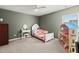 Charming bedroom featuring a white bed frame, a vanity, and a dollhouse at 1019 Victoria Pointe Ln, Summerville, SC 29485