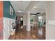 Inviting foyer with hardwood floors, stylish wainscoting, and an open view to the dining and living areas at 1019 Victoria Pointe Ln, Summerville, SC 29485