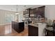 Beautiful kitchen features an island, dark cabinets, and counter seating at 1019 Victoria Pointe Ln, Summerville, SC 29485