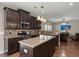 Modern kitchen boasting stainless steel appliances and a view into the Gathering room at 1019 Victoria Pointe Ln, Summerville, SC 29485