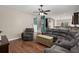 Comfortable living room features hardwood floors, ceiling fan, and ample seating at 1019 Victoria Pointe Ln, Summerville, SC 29485