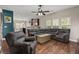 Cozy living room area with comfortable seating and large windows providing natural light at 1019 Victoria Pointe Ln, Summerville, SC 29485