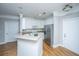 Stylish kitchen with white cabinets, stainless steel appliances, and modern finishes, next to a door at 1025 Riverland Woods Pl # 901, Charleston, SC 29412