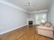 Cozy living room with fireplace, hardwood floors, and glass doors leading to the outside at 1025 Riverland Woods Pl # 901, Charleston, SC 29412