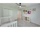 Inviting bedroom with a cozy crib, storage, and colorful wall decorations at 1027 Island View Ct, Charleston, SC 29492