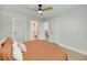 Bright bedroom featuring a ceiling fan and access to a bathroom and additional rooms at 1027 Island View Ct, Charleston, SC 29492