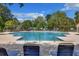 Inviting community pool with lounge chairs and palm trees, perfect for relaxation and summer fun at 1027 Island View Ct, Charleston, SC 29492
