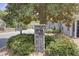 Stone community sign surrounded by greenery, indicating a well-maintained and welcoming neighborhood at 1027 Island View Ct, Charleston, SC 29492