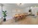 Open-concept dining room with modern lighting, stylish seating, and a seamless transition to the living area at 1027 Island View Ct, Charleston, SC 29492