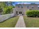 Well-maintained townhome with brick walkway, lush landscaping, and classic curb appeal in a quiet neighborhood at 1027 Island View Ct, Charleston, SC 29492