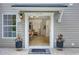 Inviting front entrance with decor, opens to bright living space with wood floors and contemporary finishes at 1027 Island View Ct, Charleston, SC 29492