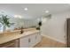 Open concept kitchen with a breakfast bar and views into the living and dining areas at 1027 Island View Ct, Charleston, SC 29492