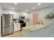 Well-appointed kitchen with white cabinetry, stainless steel appliances, and a breakfast bar for casual dining at 1027 Island View Ct, Charleston, SC 29492