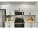 Modern kitchen featuring stainless steel appliances, subway tile backsplash, and ample countertop space at 1027 Island View Ct, Charleston, SC 29492