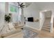 Bright and airy living room with soaring ceilings, oversized windows, and stylish furnishings for modern living at 1027 Island View Ct, Charleston, SC 29492