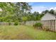 Fenced in back yard with a patch of grass and a variety of plants at 108 Gaslight Blvd, Summerville, SC 29483