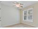 This bedroom features a ceiling fan and large windows, creating a bright and airy space at 108 Gaslight Blvd, Summerville, SC 29483