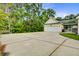 Wide driveway leads to a two-car garage, with a swing and a glimpse of the back porch at 108 Gaslight Blvd, Summerville, SC 29483