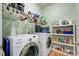 Well-organized laundry room with side by side washer and dryer at 108 Gaslight Blvd, Summerville, SC 29483
