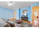 Spacious living room with a ceiling fan, wood floors, and a cozy seating area at 108 Gaslight Blvd, Summerville, SC 29483