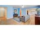 Comfortable living room with hardwood floors, a ceiling fan, and access to other living areas at 108 Gaslight Blvd, Summerville, SC 29483