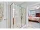 Shower with glass door and view of a beautiful bedroom at 108 Gaslight Blvd, Summerville, SC 29483