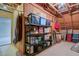 This unfinished storage room has plywood walls and shelving filled with household items at 108 Gaslight Blvd, Summerville, SC 29483