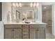 Bathroom featuring double sinks, modern fixtures, and a large mirror at 108 O'Leary Cir, Summerville, SC 29483