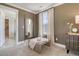 Bright bedroom featuring modern furnishings, a window with curtains, and a comfortable bench at 108 O'Leary Cir, Summerville, SC 29483