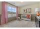 A bright bedroom with a crib, natural light, charming decor and a lovely view at 108 O'Leary Cir, Summerville, SC 29483