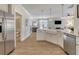 Open-concept kitchen showcases an island, farmhouse sink, stainless steel appliances, and ample counter space at 108 O'Leary Cir, Summerville, SC 29483